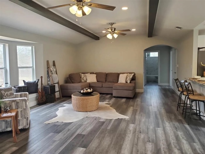 Renovated open living area with new flooring